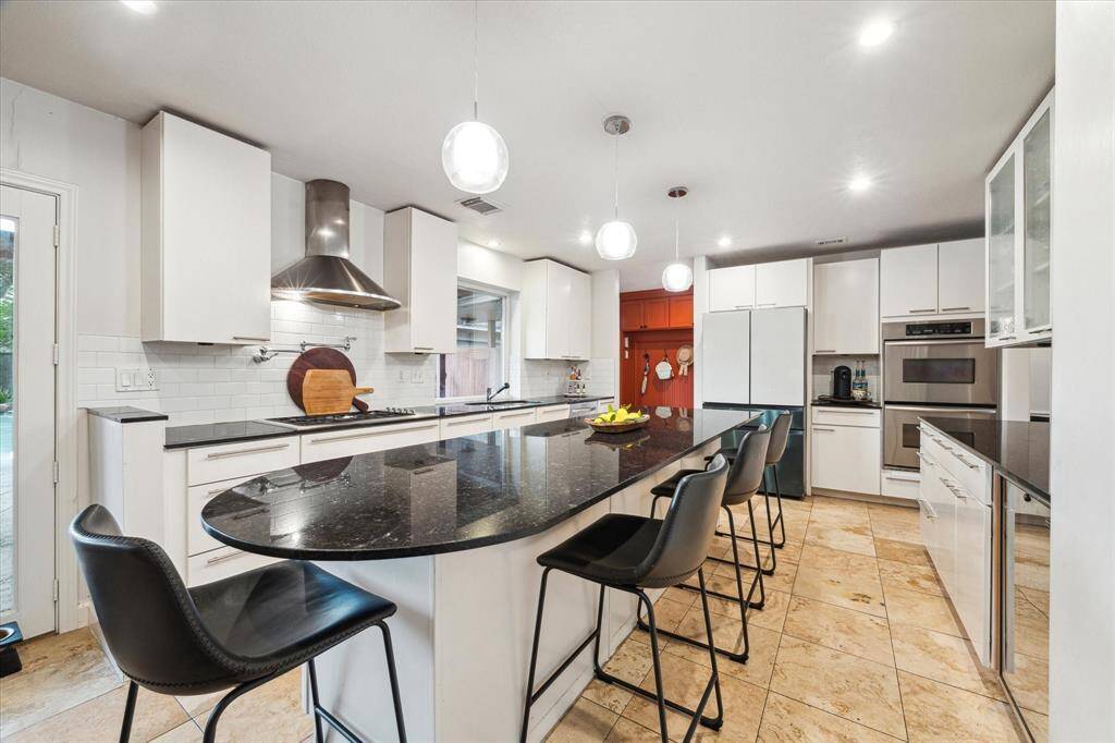 This ISLAND has enough room for EVERYONE to participate in food prep and enjoyment! It's a TRUE gathering space! Glass front refrigerator (2022) will convey!