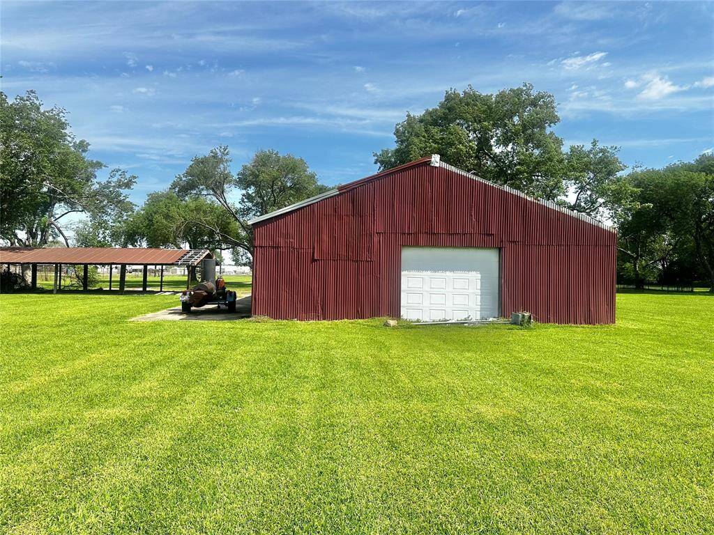 View from back of acreage lookin at the back of the barn
