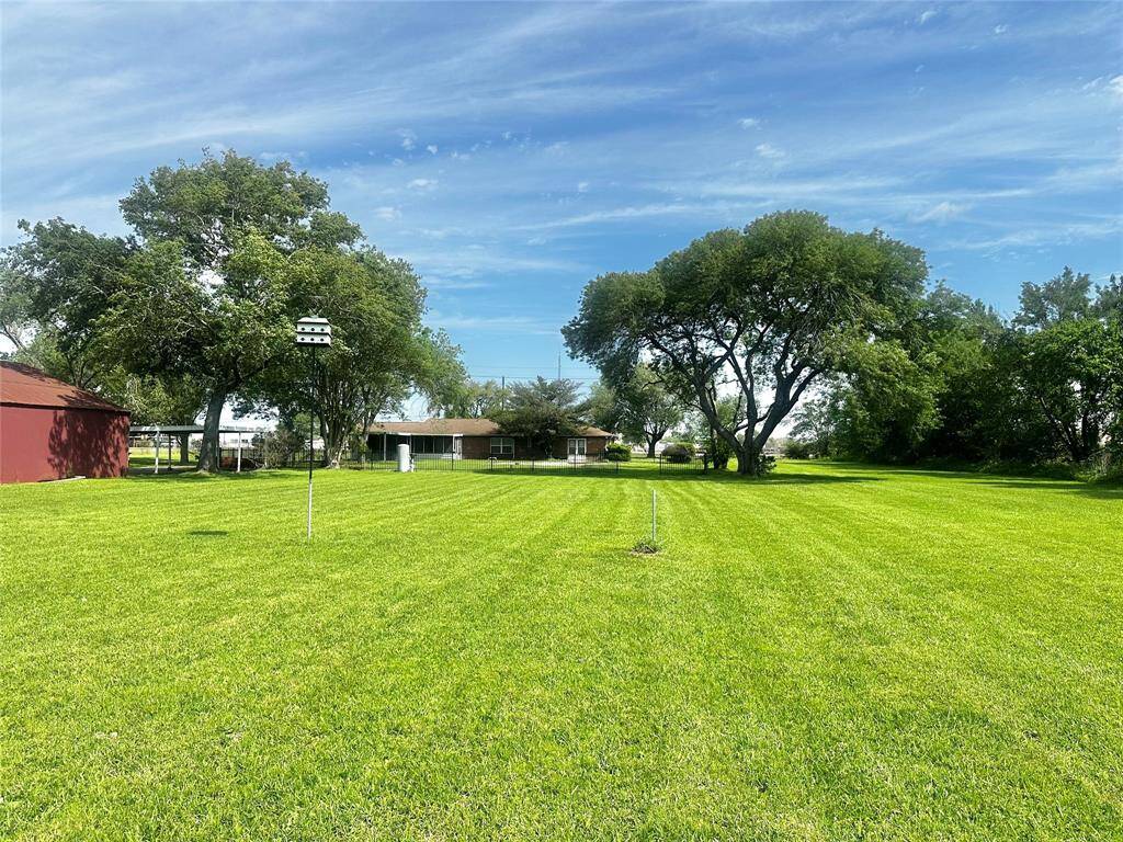 Looking from back of the acreage up to the back of the house.