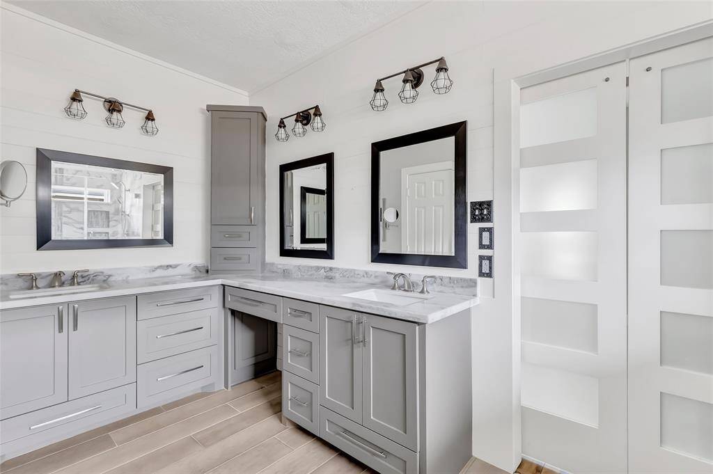 Double sinks sit atop a generous vanity, offering plenty of room for two and making busy mornings a breeze.