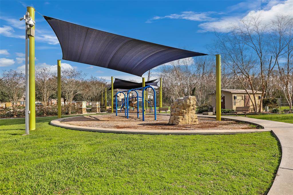 This expansive backyard offers plenty of room for outdoor activities, gardening, or simply enjoying the open space