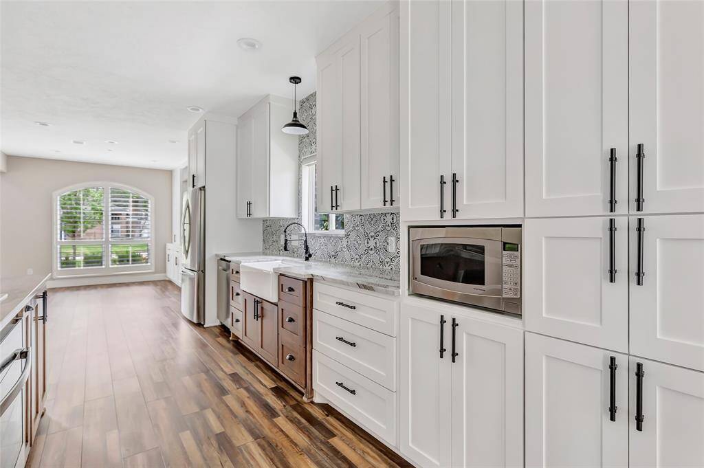Featuring custom built-in cabinetry in the formal dining area, it offers refined storage and display space for fine china, glassware, or decor.