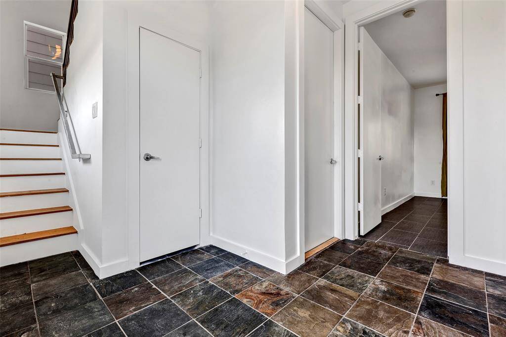 Welcoming entryway with a clear view of the main door from the inside.