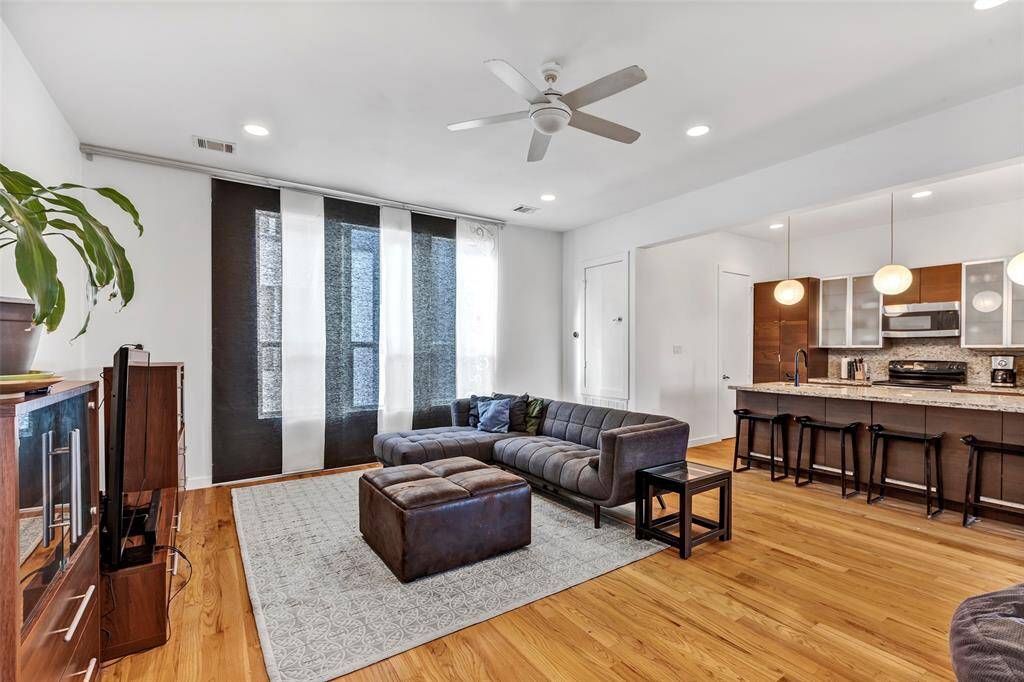 Another view of the spacious living room, seamlessly connected to the kitchen for easy living and entertaining.