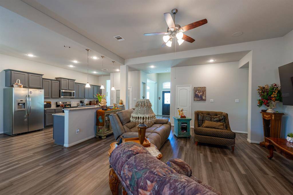 The kitchen and living areas create an effortless flow, making this home ideal for both everyday living and entertaining.