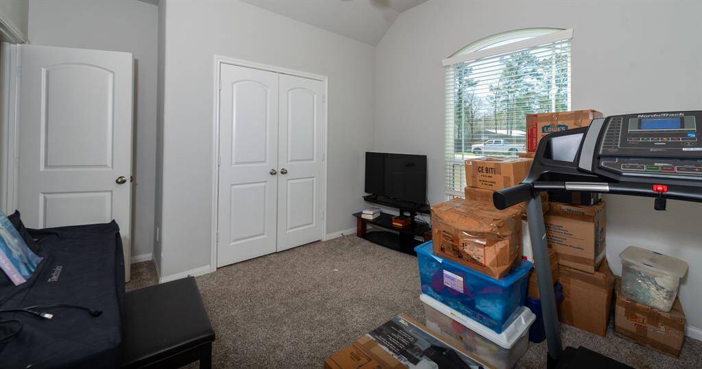 This bedroom features a double door closet.
