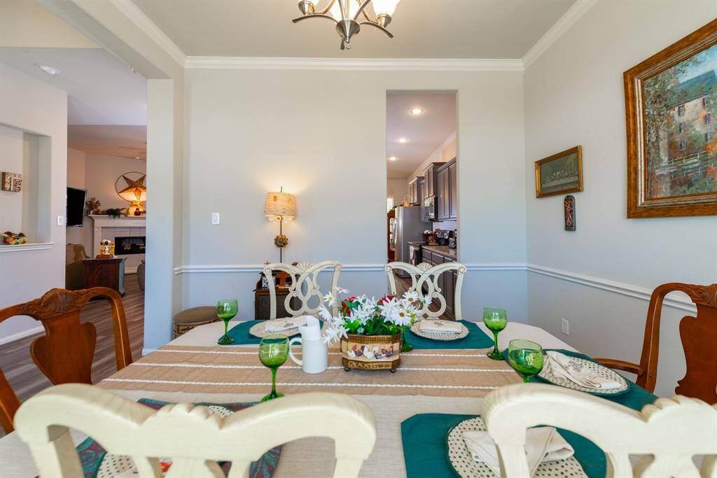 With an open layout, the dining room seamlessly connects to the kitchen and living area, creating the perfect space for entertaining guests or enjoying family meals.