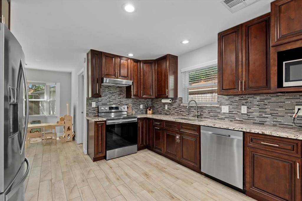 Stainless appliances give the kitchen a modern look.