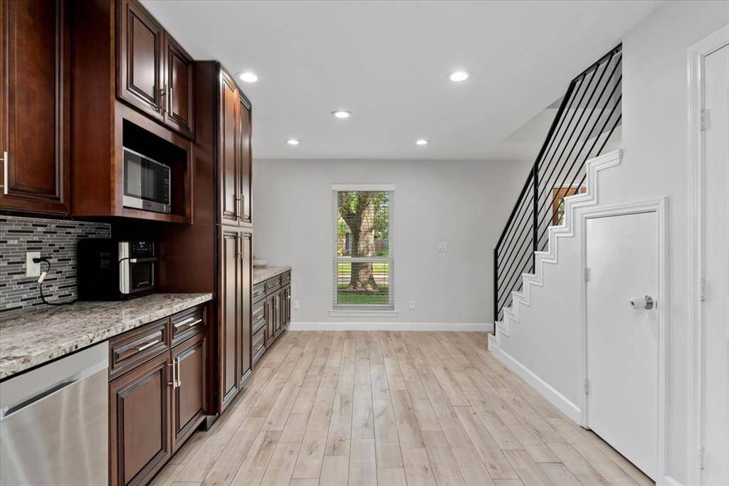 The wrought iron banisters help open up the space between the living and kitchen area.