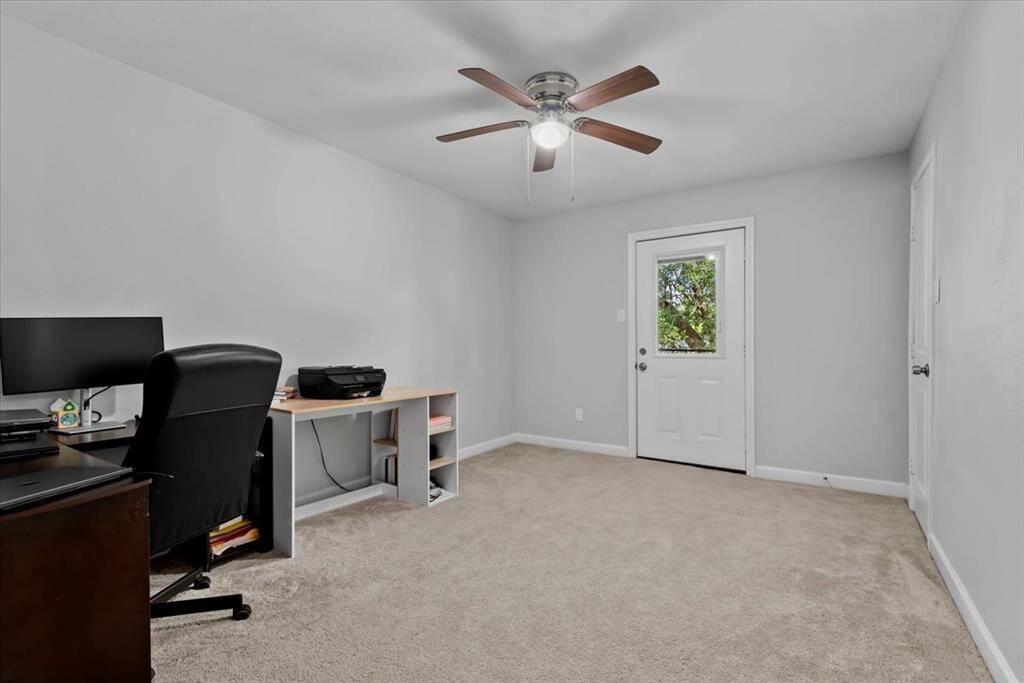 One of the upstairs bedrooms is currently being used as an office and has access to the balcony.