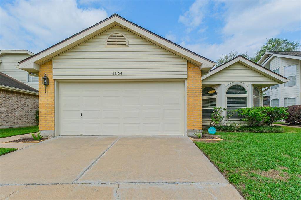 large two car garage and lovely bay window