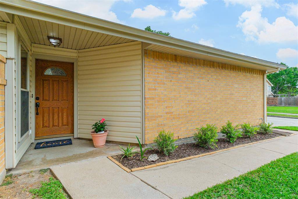 The front door is tucked back offering additional privacy and security