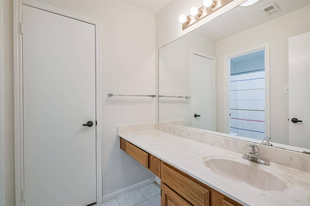 the great secondary bath has a tub and shower combination