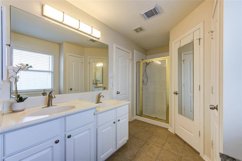 Primary bathroom with double sinks.