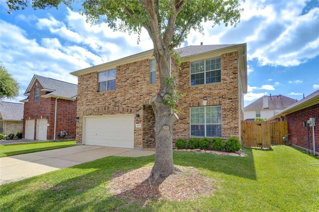 Beautiful curb appeal with front brick elevation.
