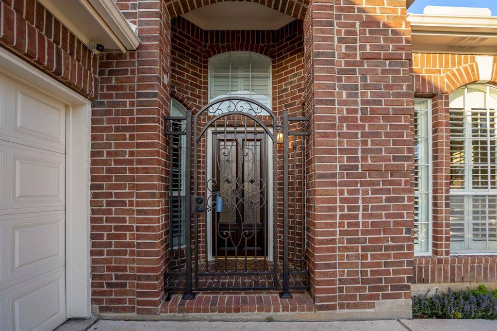 The entry is accented by this custom gate, which makes a convenient drop-off spot for deliveries.
