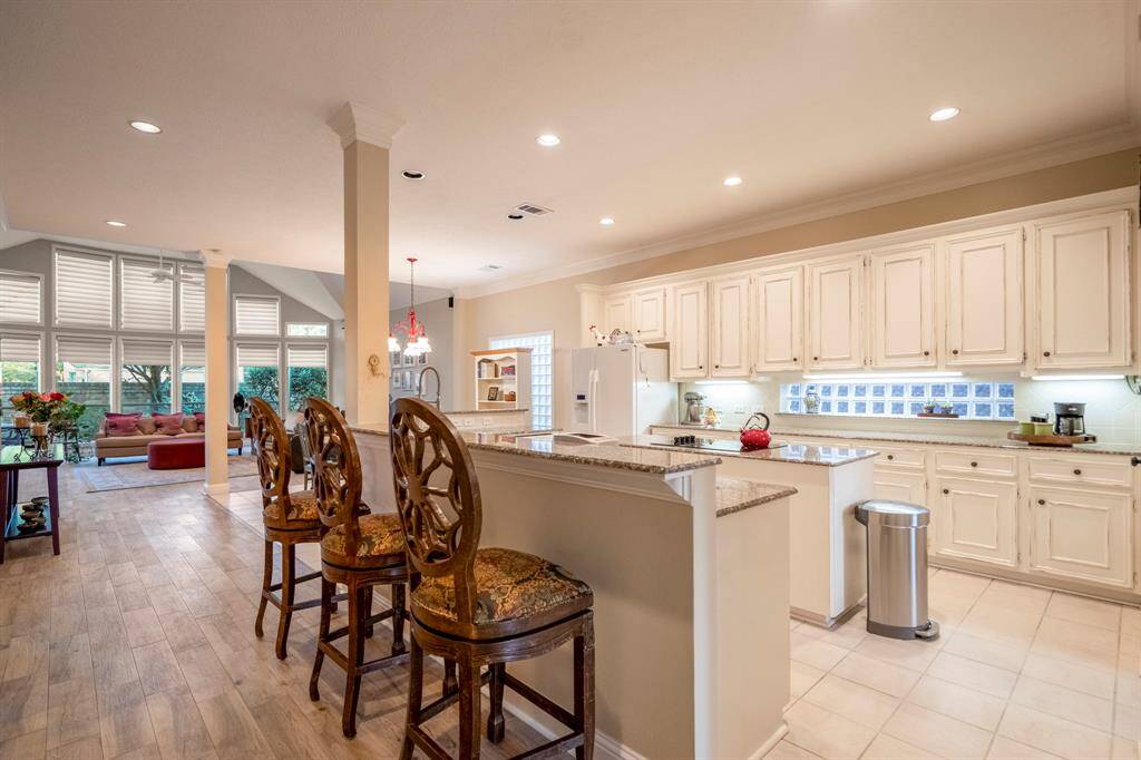 The heart of the home...the kitchen.   Glass bricks allow extra light in, and under cabinet lighting adds a warm glow.
