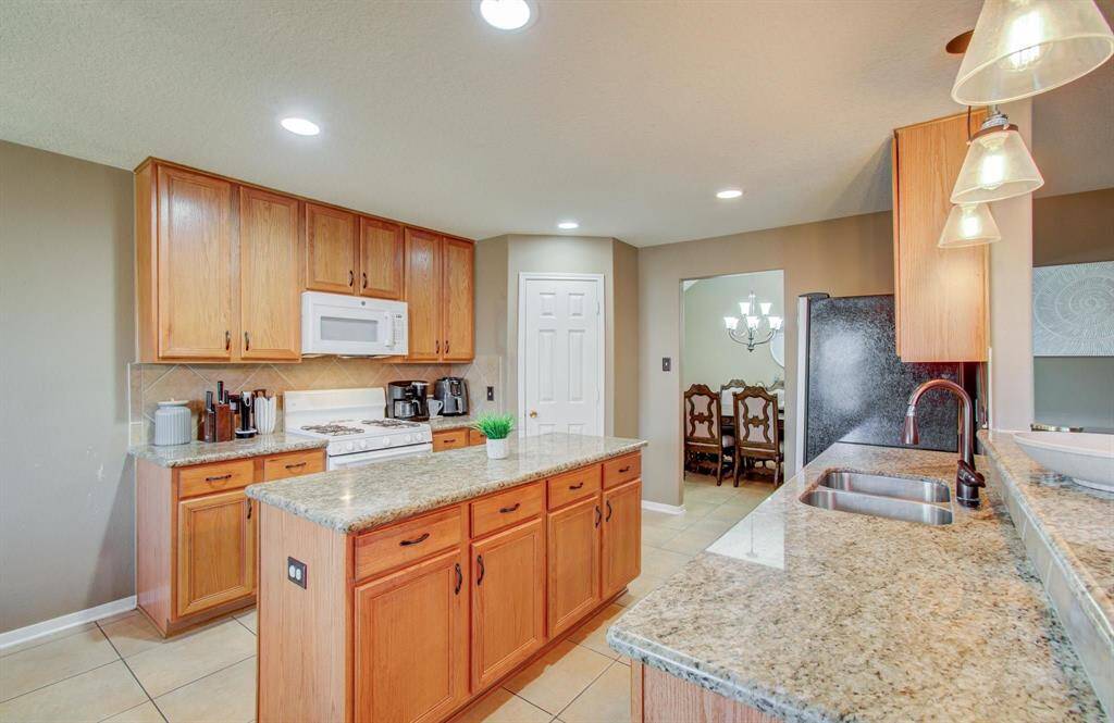 Kitchen has really good lighting provided by LED recessed lights and upgraded pendent lighting over the bi-level counters, all extremely well thought out and nice.