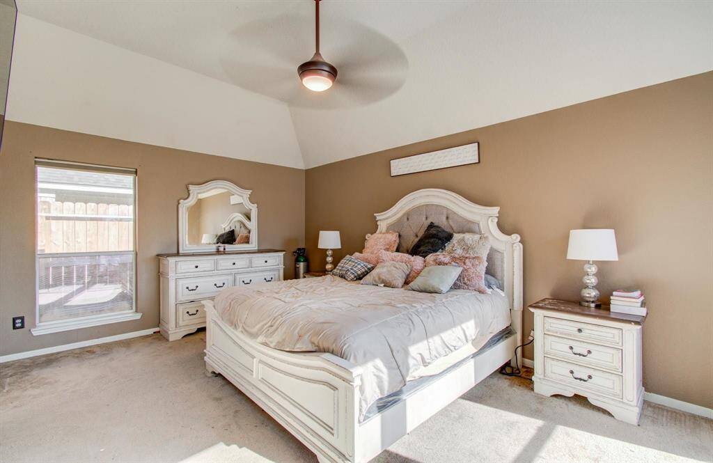 The Primary Bedroom is large with elevated ceiling which includes ceiling fan and light.