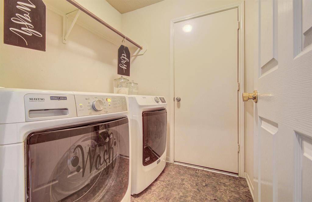 In-home laundry/utility room, fits full size washer and dryer.