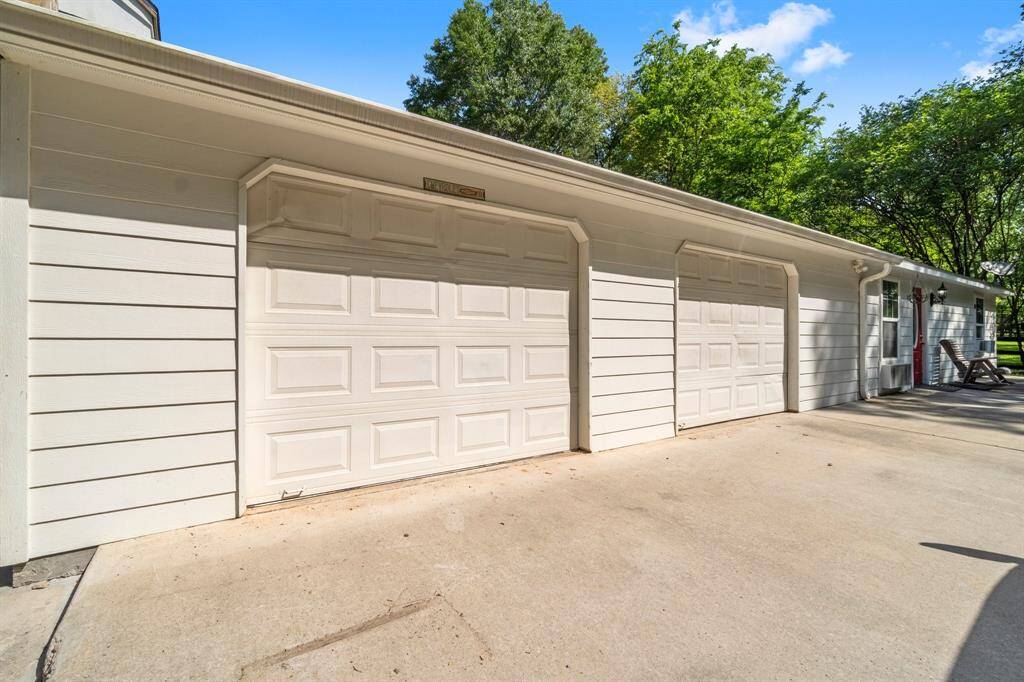 Large two car oversized garage with built in work bench.