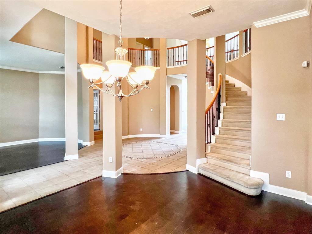 large dining area with wooden floors