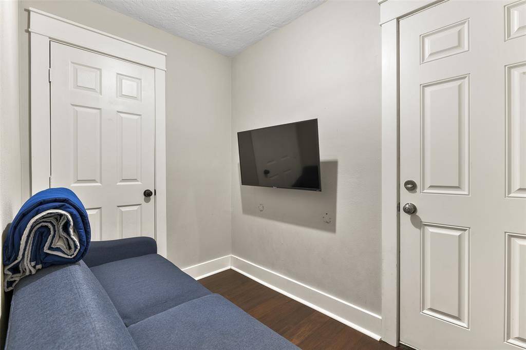 The bookcase in the family room is a clever disguise for the door to this bonus room with a multitude of uses - including exercise, crafting, a movie room, storage space, or whatever suits your needs!
