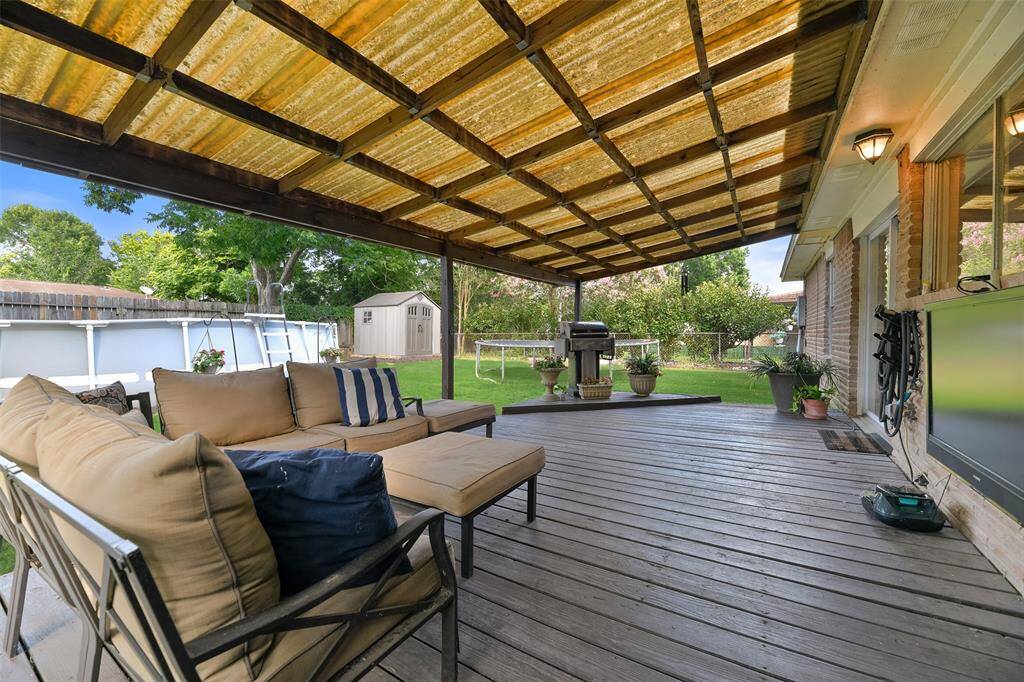 Enjoy relaxing or entertaining on this large covered patio area that's perfect for grilling and dining al fresco year round or catching a game on a breezy fall afternoon while the littles play in the large backyard.