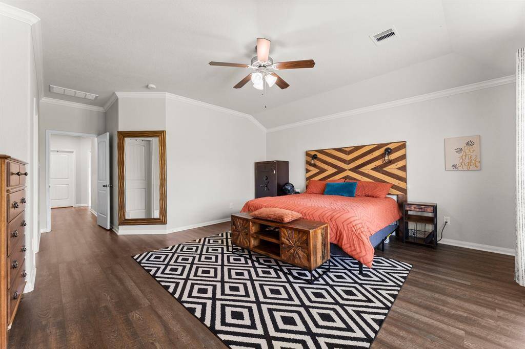 Note the crown molding and vinyl plank flooring in here as well.