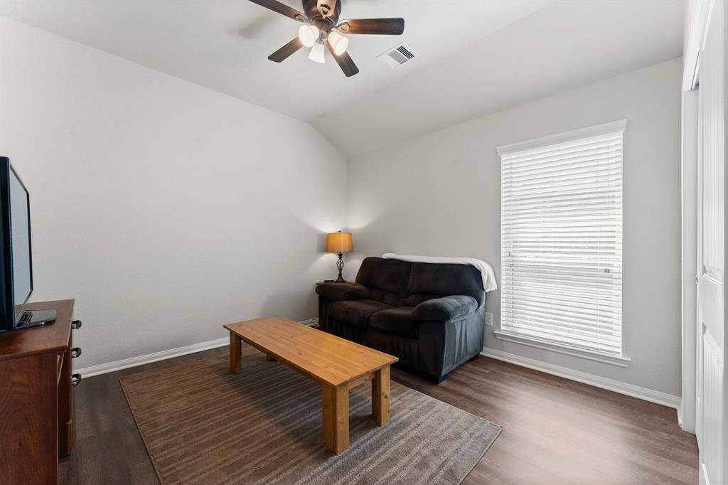 Bedroom #3 is being used as a hangout room. It is approx 12' x 12' and also has blinds and a ceiling fan.