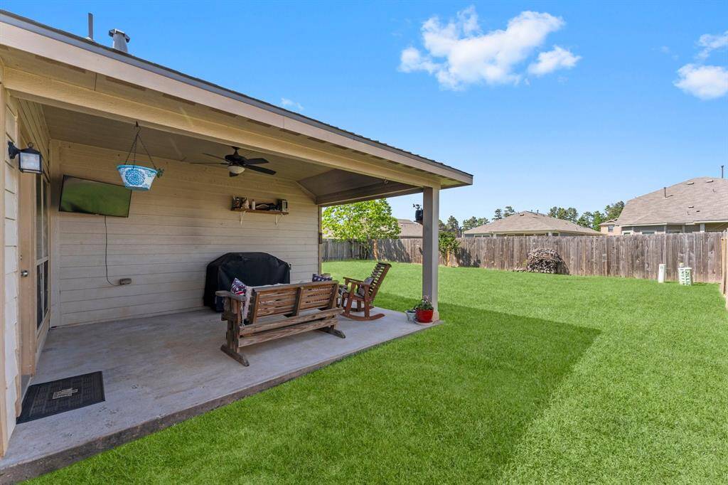 Out back, you have a great covered patio area (with gas stub-out for the grill or generator), and plenty of grass space.