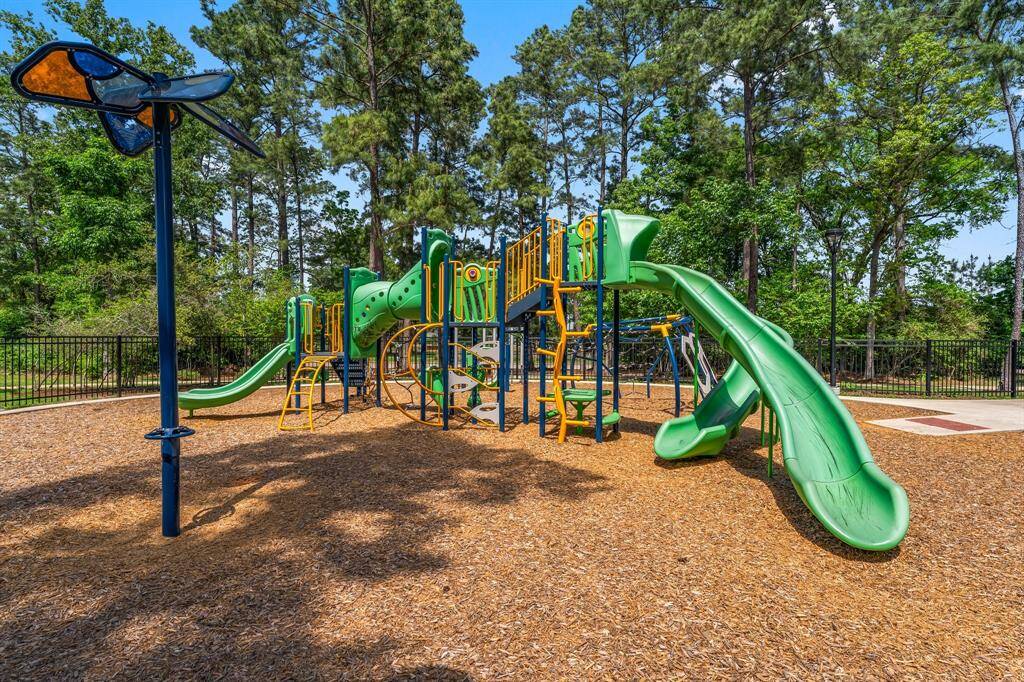 This playground area is tucked inside the wood with good shade cover.