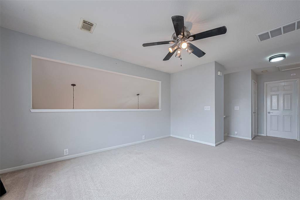 Game room overlooks living room below.