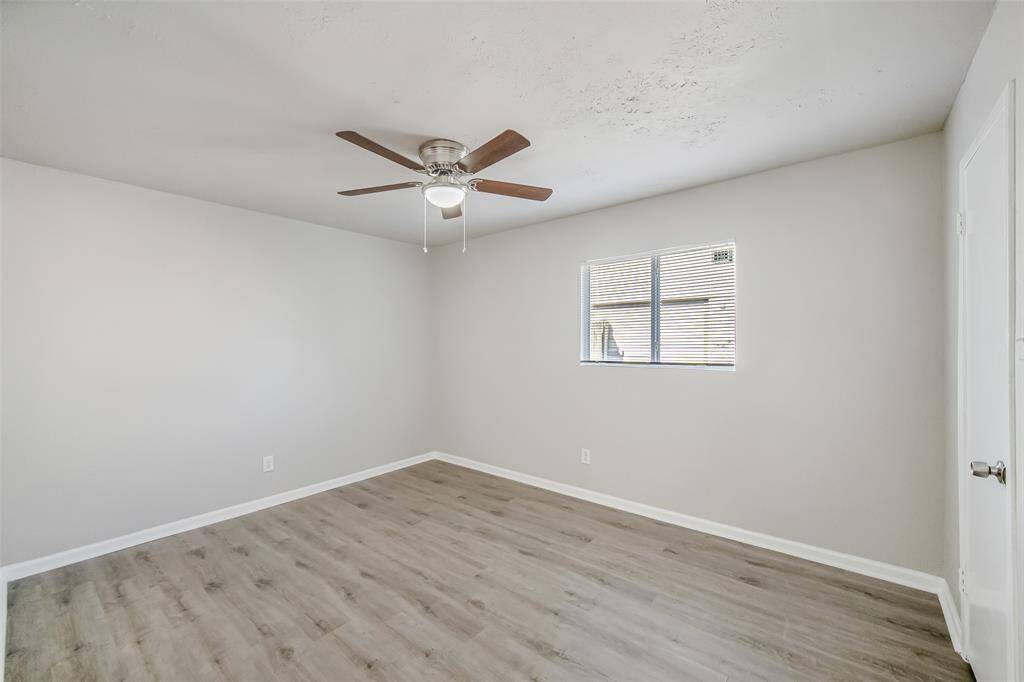 Two of two secondary bedrooms.  Also featuring designer-inspired paint and brand-new LVP flooring, adding a fresh and modern touch.