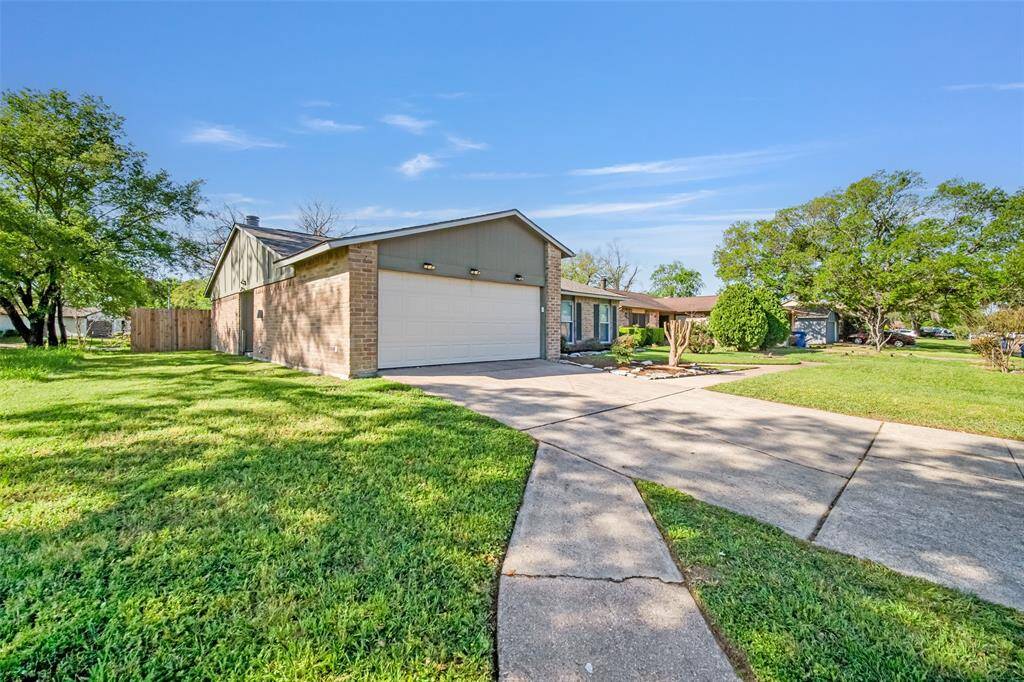 This alternate side view of the home highlights the attached two-car garage.