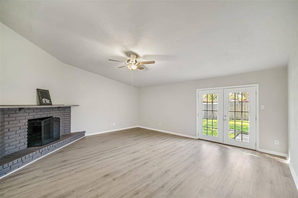 Brand-new French doors at the back allow natural light to fill the family room, creating a bright and inviting atmosphere.