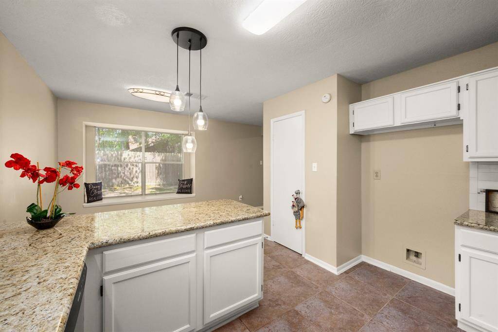 Open and updated kitchen is lite and airy