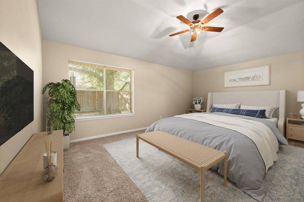 Vaulted ceiling in the primary leave this room feeling open and spacious