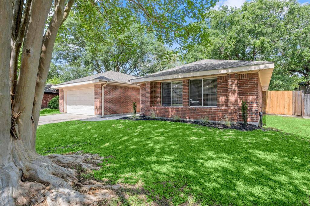 Home has mature crepe myrtle trees as well as a double driveway