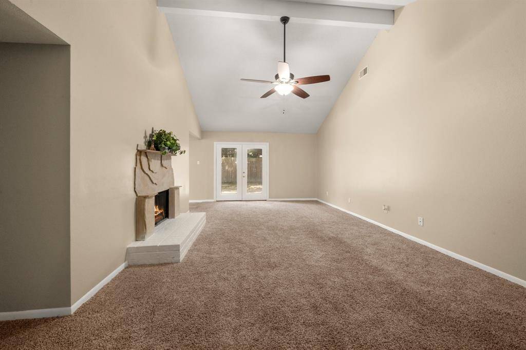 French doors anchor this space and make it easily accessible to the back yard giving lots of natural light