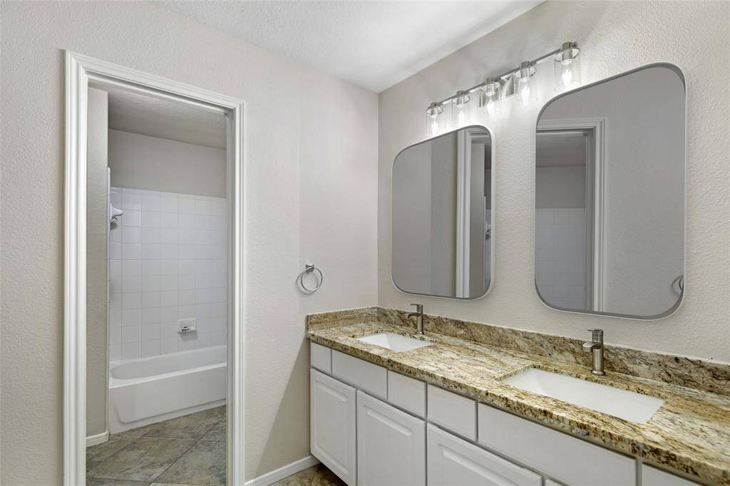 Upstairs Bathroom:  This picture has mirrors that have been Virtually staged