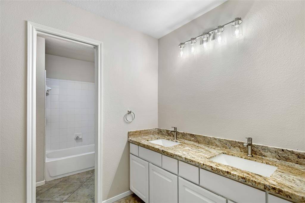 Dual Master bathroom sinks, new fixtures, new granite, new lighting & fresh paint. Note: New Mirror has been installed