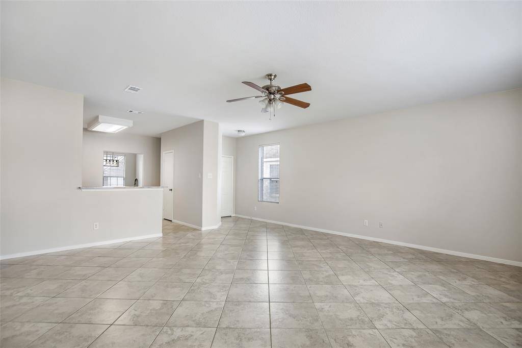 View 2 of living room.  The downstairs has one bedroom/den, kitchen & dining area.