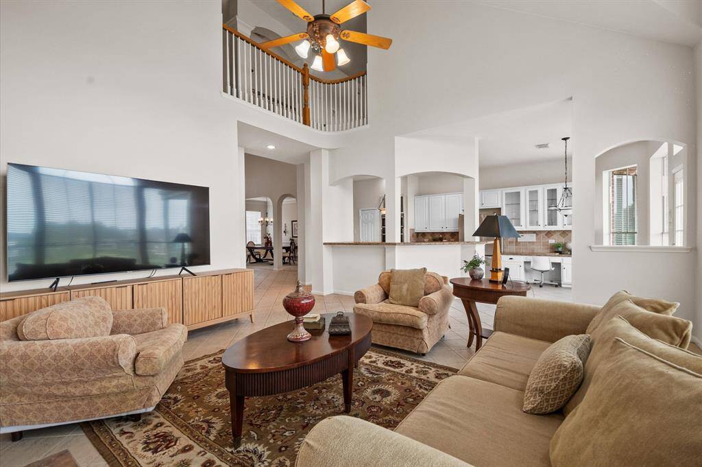 The family room has a large wall for your TV and is open to the kitchen.