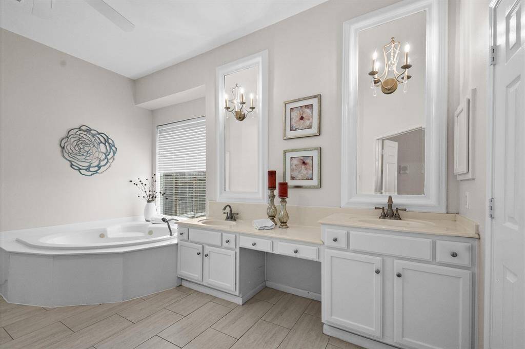 The primary bathroom has a large tub and walk-in shower (not shown. The closet is a great size too!