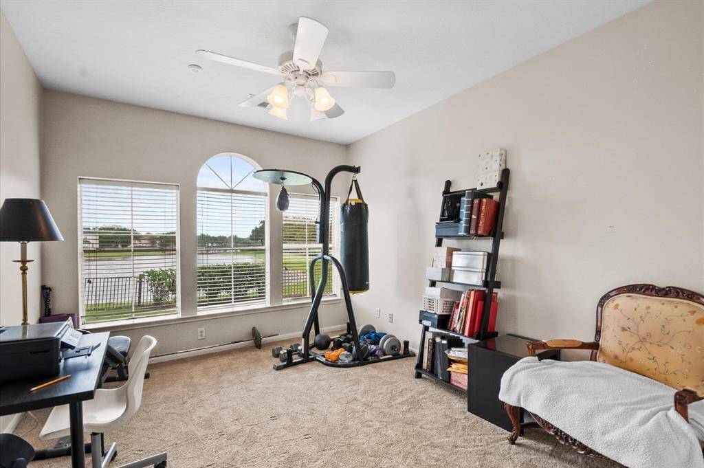 This is the privately situated "extra room" right off the garage entry. It can be another bedroom (has a closet), a home office, or an exercise room.