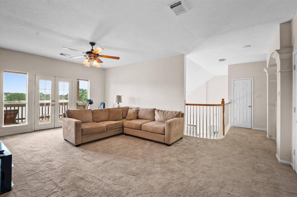 The gameroom has huge and has a closet. Access to the balcony is through the French doors.