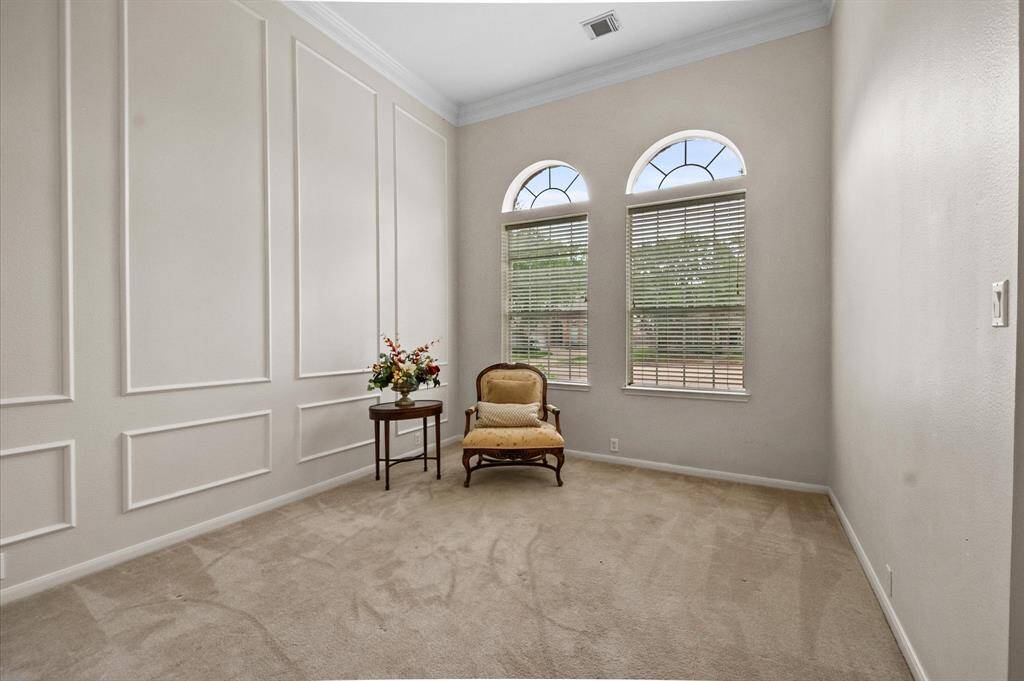 Picture frame moldings in the formal living room add elegance.