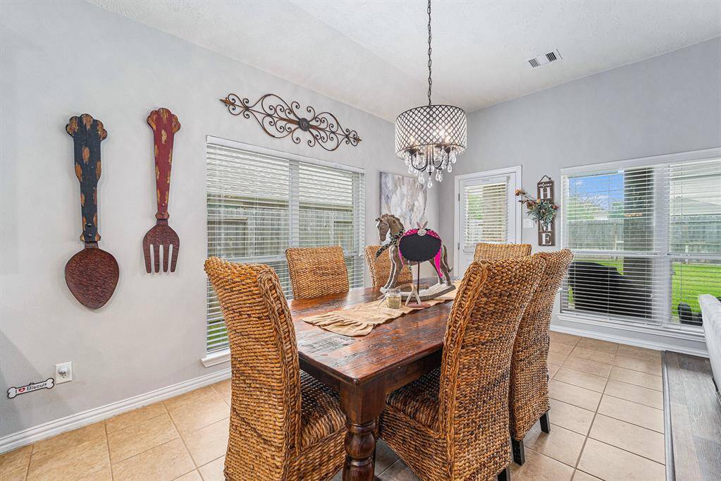 Adorable breakfast nook off the kitchen with ample natural light!