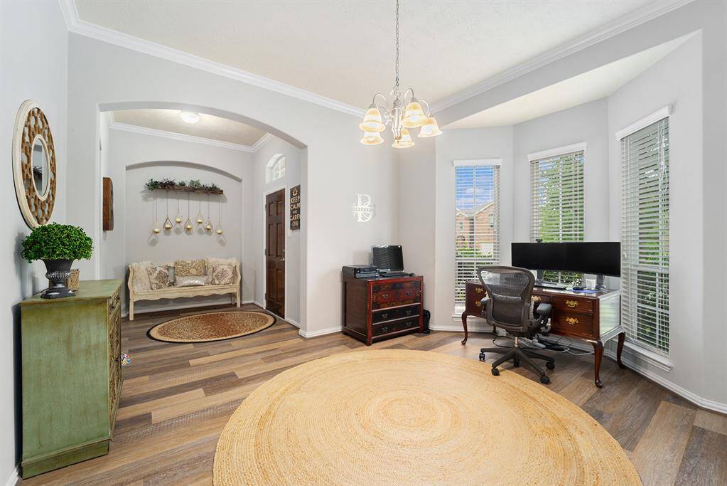 Spacious flex room that is currently being used as a home office.